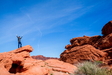 A man enjoys the spectacular view of red mountains at the Calico I stop. It belongs to the world...