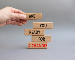 Change symbol. Wooden blocks with words Are you ready for a new change. Businessman hand. Beautiful grey background. Business and change concept. Copy space.