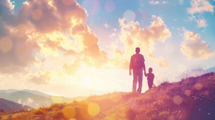 A man and a child stand at the summit of a hill, looking out at the landscape below