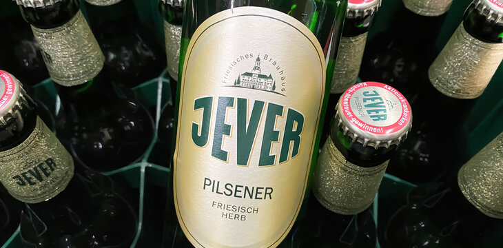 Viersen, Germany - May 9. 2024: Closeup of Jever Pilsener beer bottle in crate in german store