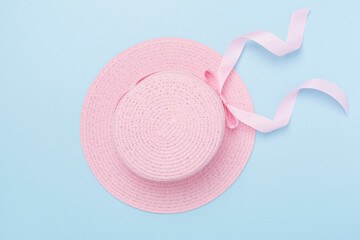 Pink hat on color background, top view. Summer concept