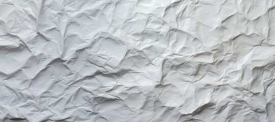 white crumpled sheet of plastic with many creases and wrinkles, background texture