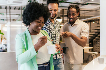 Diverse team enjoying a coffee break in a modern coworking space