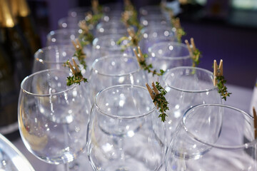 Table with champagne stemware and man in background at event
