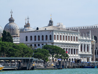 San Marco vaporetto pier with the cathedral domes in background - obrazy, fototapety, plakaty