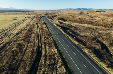 Fototapeta na wymiar Aerial: Desert road in the Waiouru Military Area, Waiouru, Manawatū-Whanganui, New Zealand.
