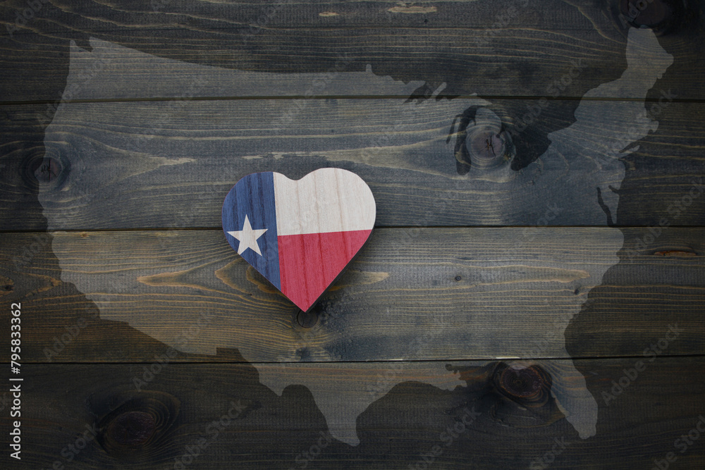 Wall mural wooden heart with national flag of texas state near united states of america map on the wooden backg - Wall murals