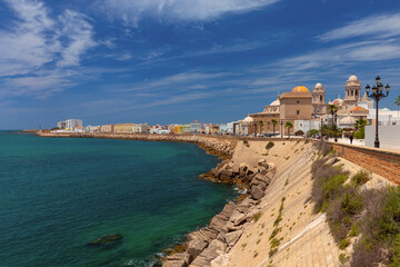 Cathedral of the Holy Cross on the waterfront of Cadiz on a sunny day.