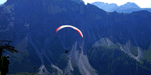 Parapentes launched from a high alpine meadow - obrazy, fototapety, plakaty