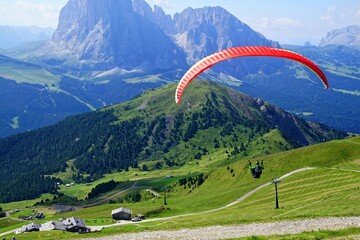 Parapentes launched from a high alpine meadow - obrazy, fototapety, plakaty