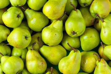 Numerous fresh green pears tightly packed, displaying a variety of shapes and sizes, with visible stems and speckled textures.