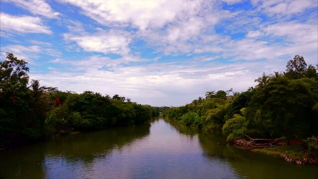 Timelapse view of the Kali Jali river in Indonesia. beautiful movement of clouds and water