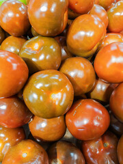 Shiny Kumato Tomatoes on Display