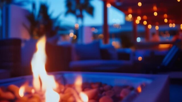 Blurry image of a chic rooftop bar featuring flickering fire pits and comfortable seating arrangements perfect for a relaxing evening under the stars. .