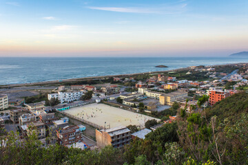 Fototapeta premium Small village with morning in state of Jijel, Algeria, rural village, A beautiful Mediterranean village in North Africa, Algeria from above, A small town overlooking the Mediterranean sea.