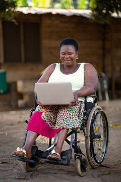 Disabled black woman watching a video on her laptop