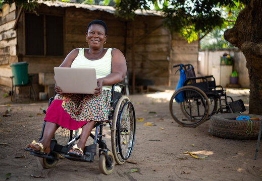 Disabled black woman watching a video on her laptop