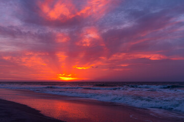 Fototapeta na wymiar Very Colorful Twilight over Beach and Sea