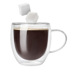 Sugar cubes falling into glass cup of coffee on white background