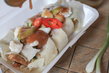 Fresh Spring rolls with crab on top and sweet sauce. Asian Food Thai style sideview. Healthy food concept.
