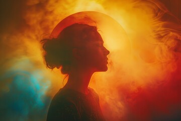 A woman's silhouette is shown in a colorful background with smoke