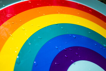 Multicolored rainbow with water drops after rain abstract background. LGBT, LGBTQ symbol. World...