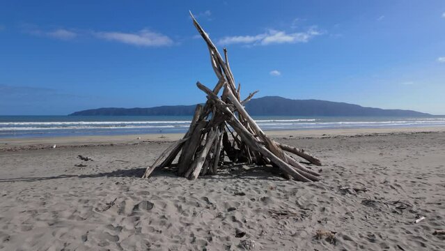 Driftwood sculpture with a view to Kapiti Island. Paraparaumu, Wellington, New Zealand.