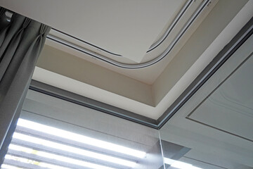 Curtain rails in bedroom corner. Double curtain rails and ceiling board design for room corner,...