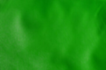 green abstract background with blur and wavy surface