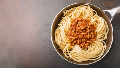 Top view of spaghetti bolognese pasta in a pan.