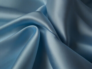 Obraz premium Sublime Serenity Capture the serene beauty of blue silk fabric as it catches the light, casting soft shadows and gentle highligh