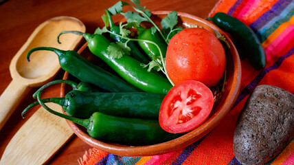 Green Spicy Serrano Peppers with Tomatoes and Coriander.  Ingredients for Mexican food cuisine....