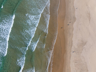 A vertical view of the waves and coastline.