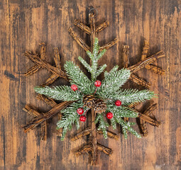Pine twig ornaments on wooden background for Christmas