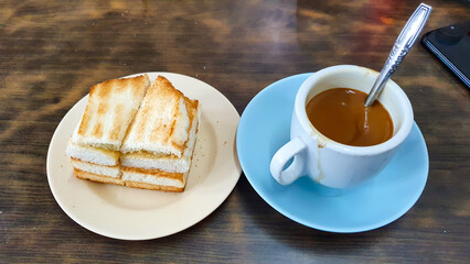 Kaya Toast And Milk Coffee Of Singaporean Breakfast. Kaya Toast Is Toasted Bread Filled With Butter...