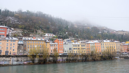 Row Of Colorful Houses On Riverbank In Winter In Grenoble, France.