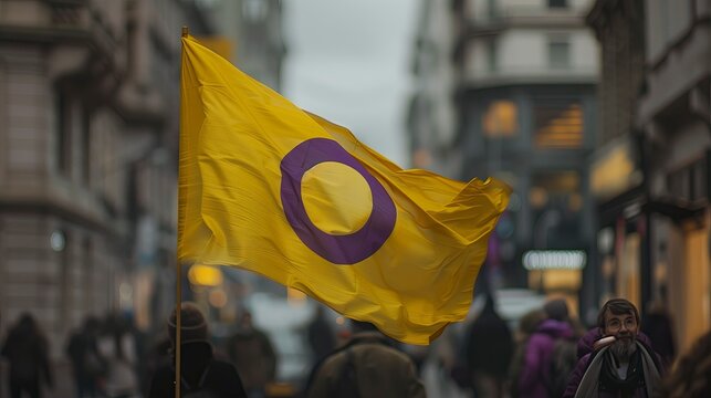 Intersex flag waving in street - LGBT concept