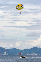 Beautiful Sea Coast Resort With Beach Activity Parasailing In Nha Trang Beach, Vietnam.