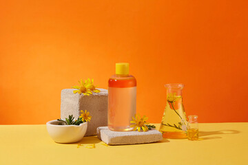 Front view of cosmetic bottle with ingredient from calendula extract displayed on brick podium....