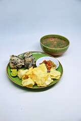 Fried Beef Oxtail with Sambal Balado. Boiled beef oxtail until tender, fried until slightly crispy and served with fresh spicy balado chili sauce.