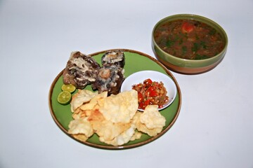 Fried Beef Oxtail with Sambal Balado. Boiled beef oxtail until tender, fried until slightly crispy and served with fresh spicy balado chili sauce.