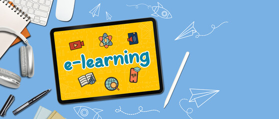 Digital tablet and supplies on orange background with word e-learning. Online education concept