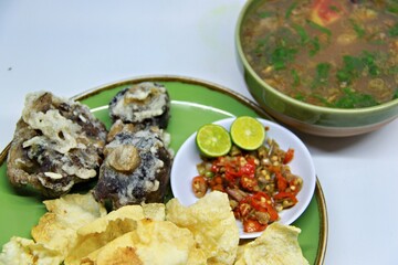 Fried Beef Oxtail with Sambal Balado. Boiled beef oxtail until tender, fried until slightly crispy and served with fresh spicy balado chili sauce.