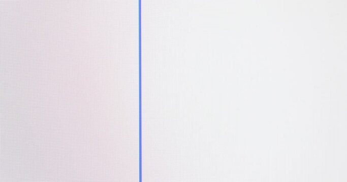 Closeup of computer screen with word OK in black text on a white background