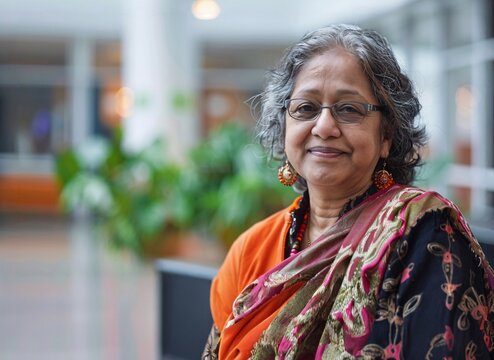 Portrait of a middle aged indian woman in office.