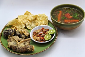 Fried Beef Oxtail with Sambal Balado. Boiled beef oxtail until tender, fried until slightly crispy and served with fresh spicy balado chili sauce.