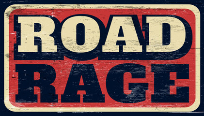 Aged and worn road rage sign on wood
