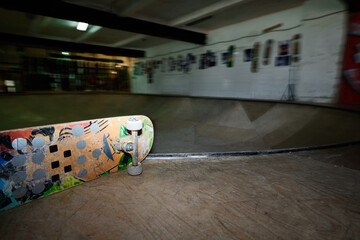 No people motion blur flash shot of skateboard and skatepark interior, copy space © AnnaStills
