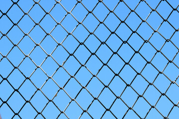 chain link fence with blue sky