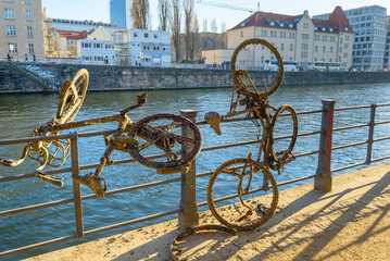 Bicycles that were taken out of a river and are covered in shells and algae, old junk bicycles that...